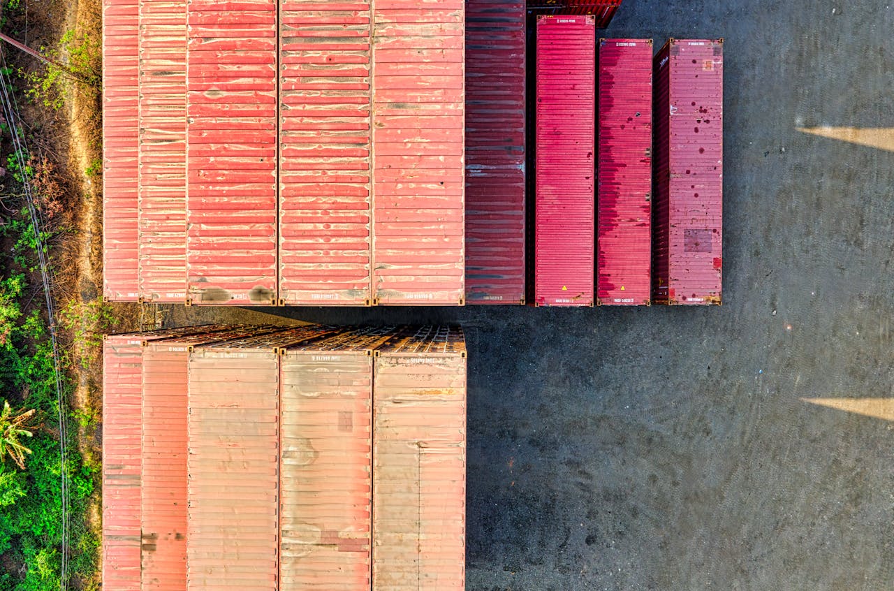 services-02 Top-down view of colorful cargo containers in an industrial area, Jakarta.